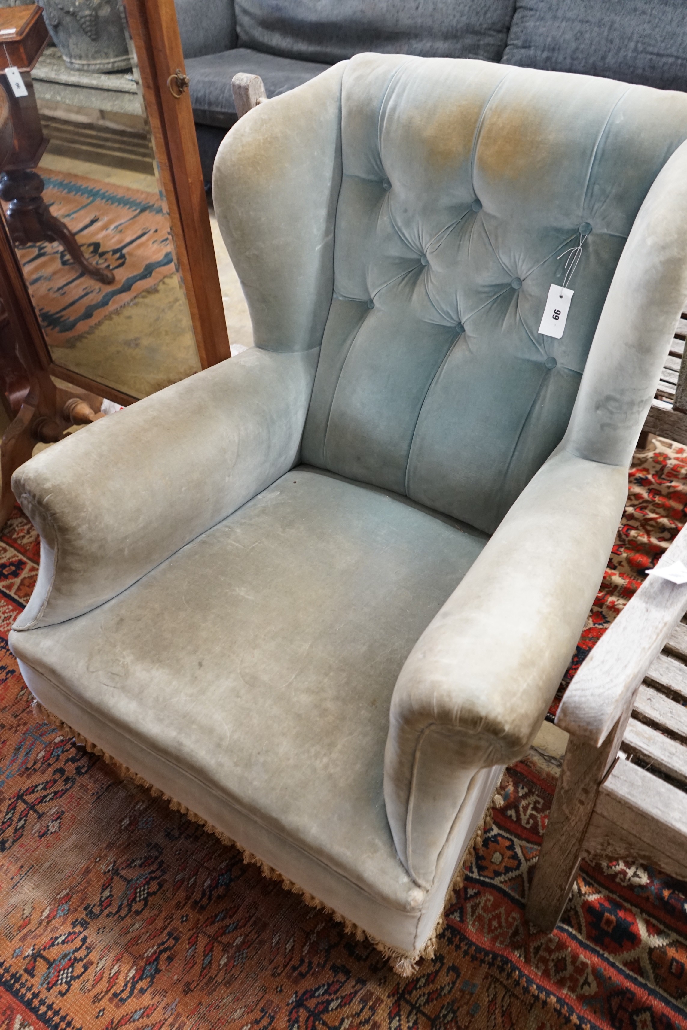 A late Victorian upholstered wing armchair, width 76cm, depth 82cm, height 90cm